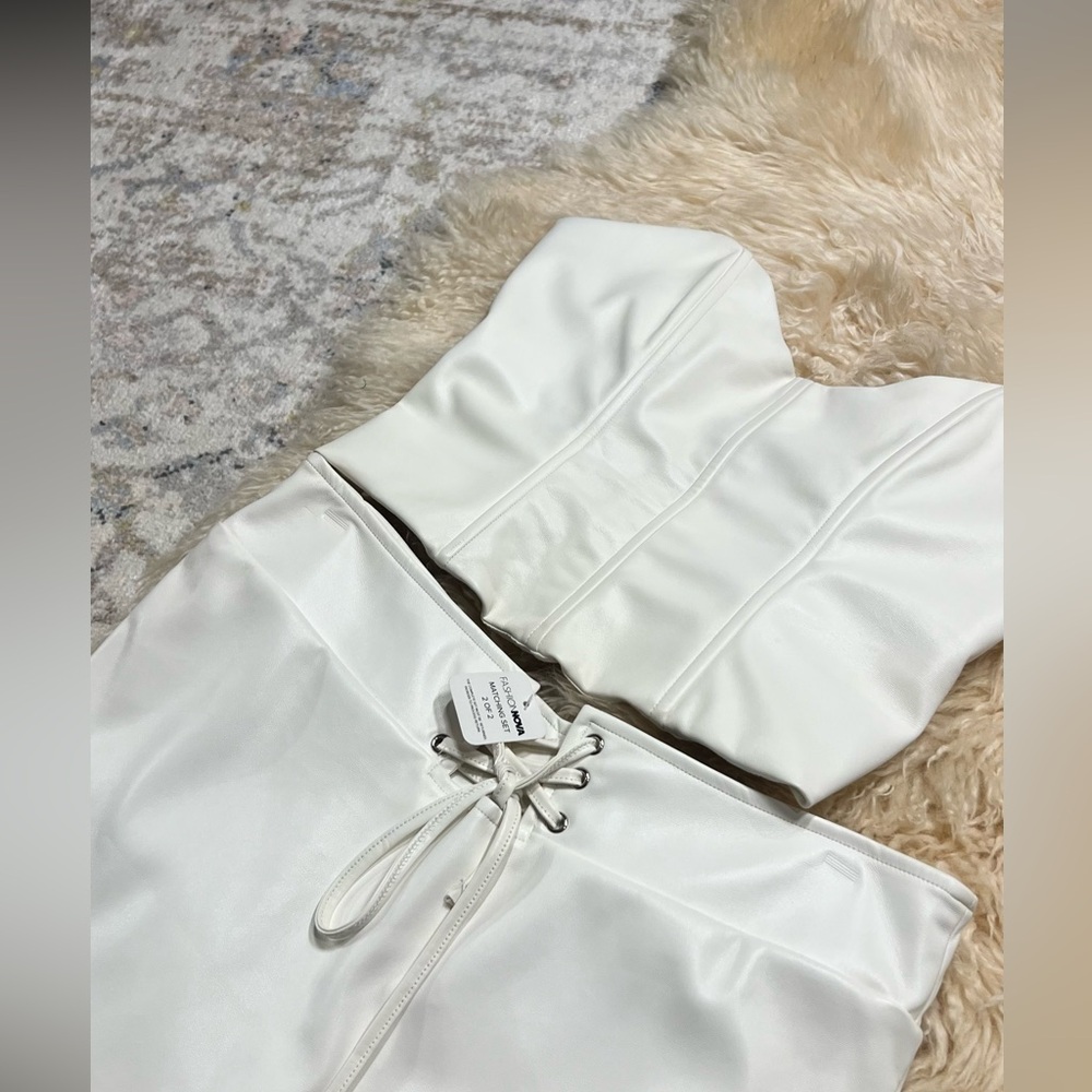 Fashion nova white leather set. Slight dents from where hanger hung.